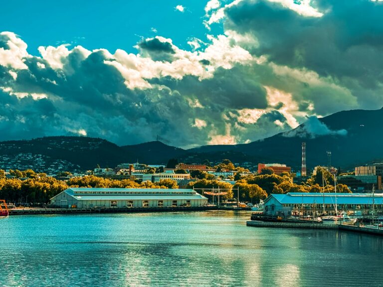 a body of water with a city in the background